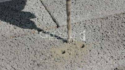 Drilling hole into concrete. Close Up.