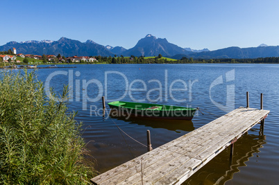 Alps panorama with lake, runway and boat