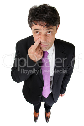 Businessman raising a finger and tapping his nose