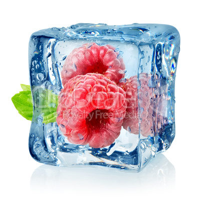 Ice cube and raspberries isolated