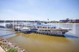 cruise ships docked on danube river shore in budapest