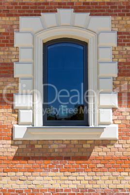 window in a red brick wall