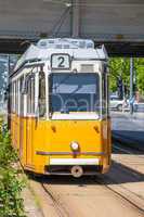 yellow tram under elisabeth bridge in budapest