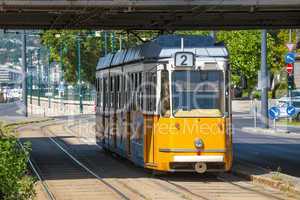 yellow tram under elisabeth bridge in budapest
