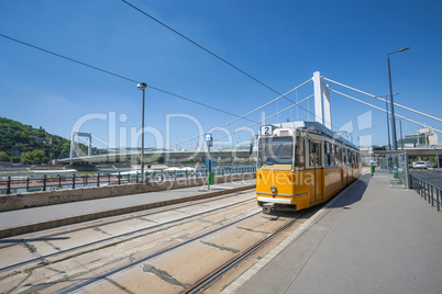 yellow tram on the river bank of danube in budapest