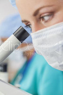 Female Woman Scientist Using Microscope in Laboratory
