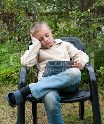 Kid with tablet pc.