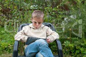 Kid with tablet pc.