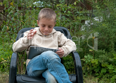 Kid with tablet pc.