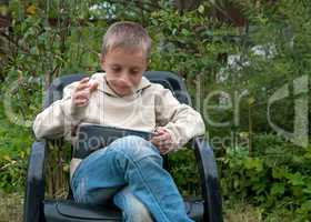 Kid with tablet pc.