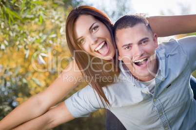 Mixed Race Romantic Couple Portrait in the Park