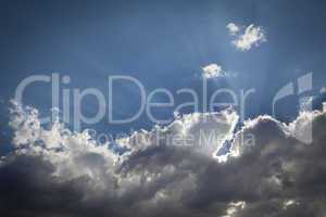 Silver Lined Storm Clouds with Light Rays and Copy Space