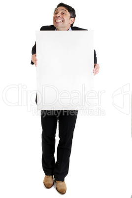 Man with a cheesy grin holding a blank sign