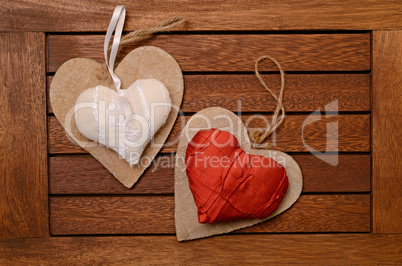 Two hearts on a wooden background