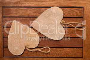 Two hearts on a wooden background