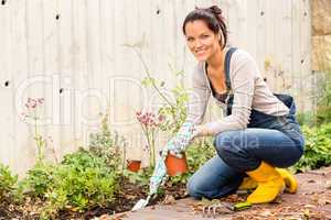 Smiling woman autumn gardening backyard hobby