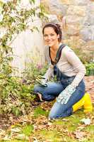 Smiling woman gardening yard fall hobby housework