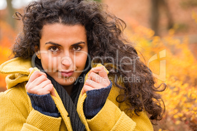 Woman portrait autumn background wind blowing hair