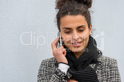 Smiling woman talking on the cell phone Smiling woman talking on the cell phone