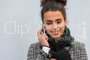 Smiling woman talking on the cell phone