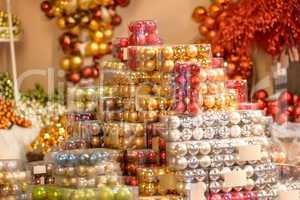 Pile of shiny Christmas balls in boxes