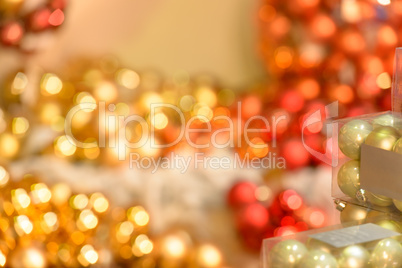 Blurred sparkling red and golden Christmas bulbs