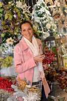 Cheerful woman shopping Christmas decorations