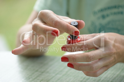 woman red nail polish