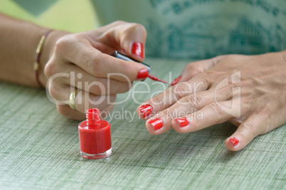 woman red nail polish