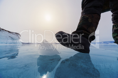 frozen lake baikal and human leg