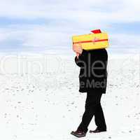 Man running in winter weather with package