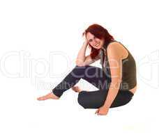 Girl sitting on floor.