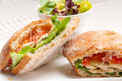 ciabatta panini sandwich with chicken and tomato