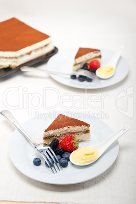 tiramisu dessert with berries and cream