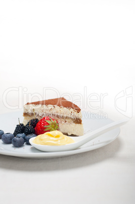 tiramisu dessert with berries and cream