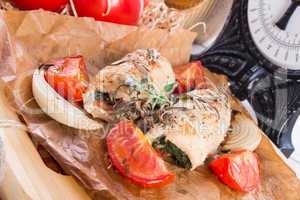 chicken breast with spinach, baked tomatoes and herbs