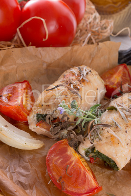 chicken breast with spinach, baked tomatoes and herbs