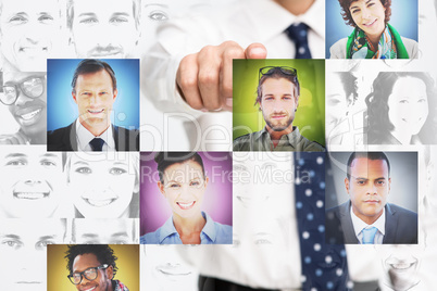 Businessman pointing at digital interface presenting profile pic