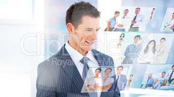 Smiling businessman looking at pictures