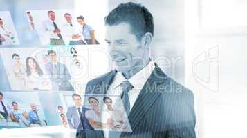 Pleased businessman looking at pictures