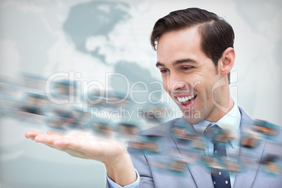 Joyful businessman looking at a picture whirl