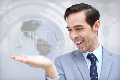 Amazed businessman looking at his hand