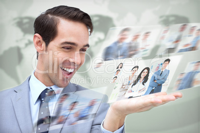 Content businessman looking at pictures