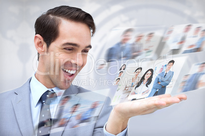 Joyful businessman looking at pictures