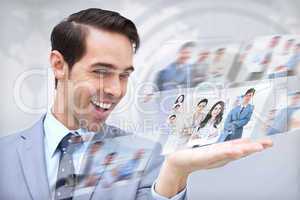 Joyful businessman looking at pictures