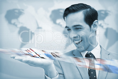 Delighted businessman looking at a picture stream
