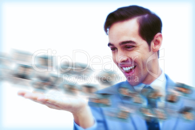 Amused businessman looking at a picture stream