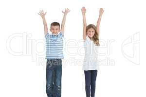 Happy young brother and sister cheering