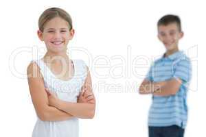 Smiling young girl posing with her brother