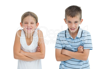 Smiling brother and sister posing together